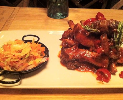 Sweet Tea Brined Southern Ribs tender ribs smothered in housemade BBQ, pickled chilies, southern slaw